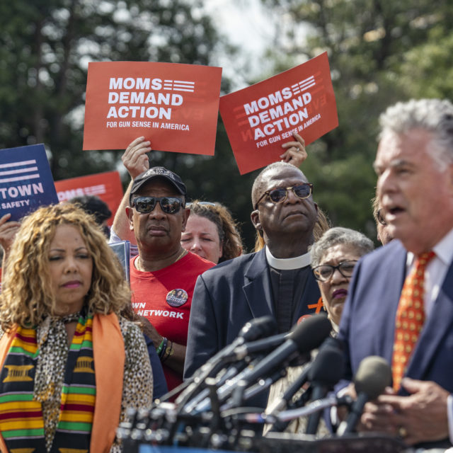 Lucy McBath and Moms Demand Action volunteers at a press conference