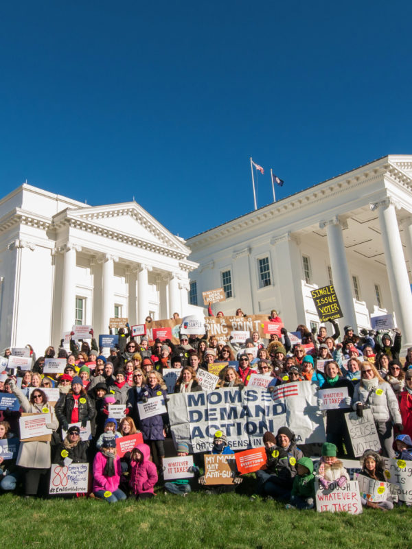 A large crowd of Moms Demand Action volunteers pose for a photo at the state capitol on MLK Day in Virginia