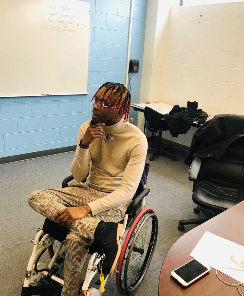 Paris “Tree” Brown, a 25-year-old man, sits in a wheelchair