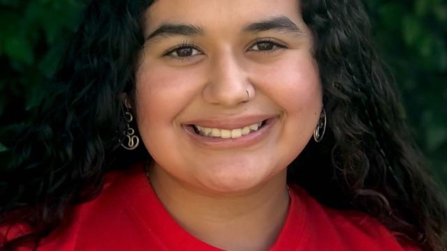 Alé smiles while wearing a Students Demand Action shirt