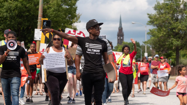 A group of volunteers marches in Baltimore