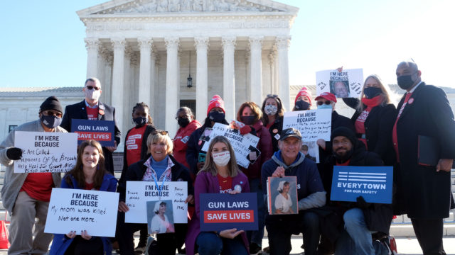 A group of 15 gun violence prevention advocates and survivors of gun violence stand in Washington, D.C. at a SCOTUS hearing rally for survivors of gun violence in 2021