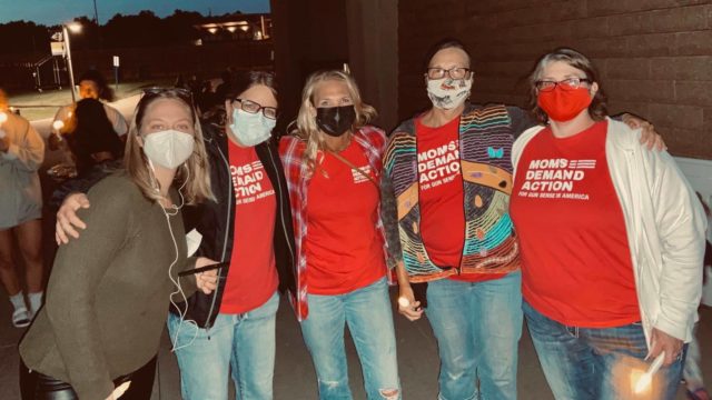 Masked South Dakota Moms Demand Action volunteers pose for a photo