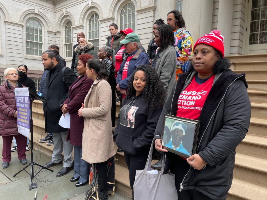 New York Moms Demand Action volunteers pose outside a courthouse