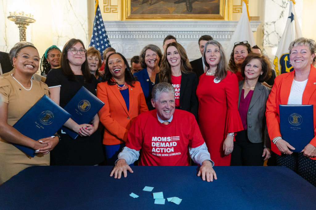 Rhode Island Governor Dan McKee poses for a photo with Moms Demand Action volunteers