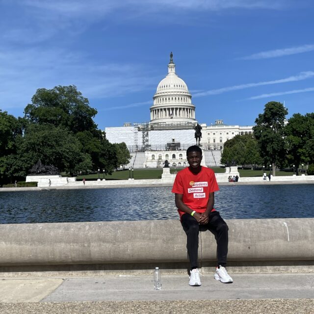 Jakoby Mitchell poses for a photo in front of the U.S. Capitol