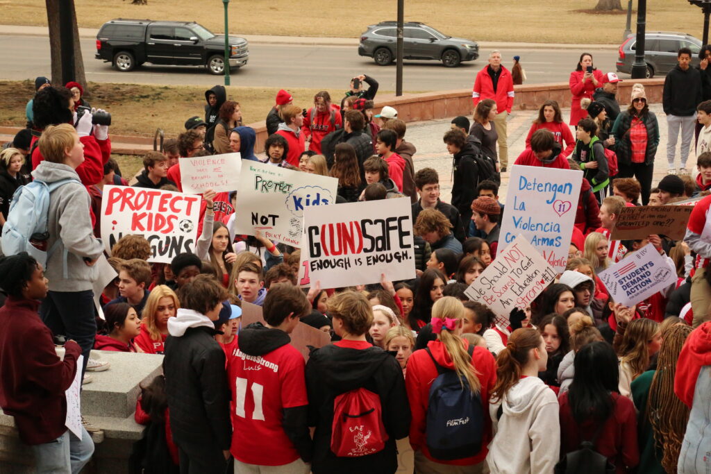 Students Demand Action volunteers rally and hold signs at the Colorado State Capitol