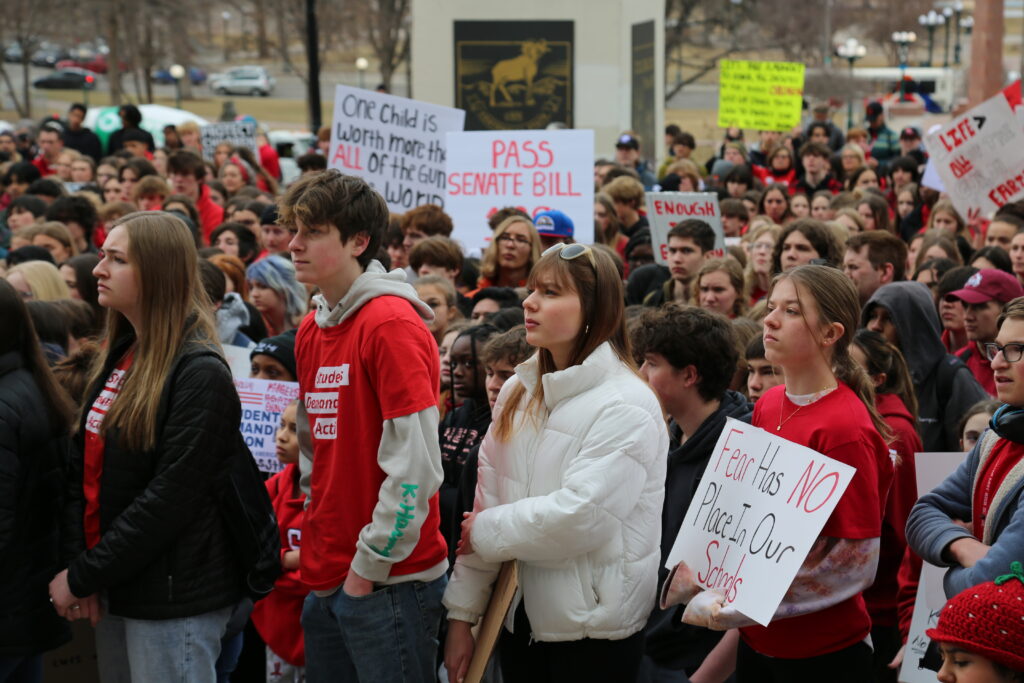 Students Demand Action volunteers rally and hold signs at the Colorado State Capitol