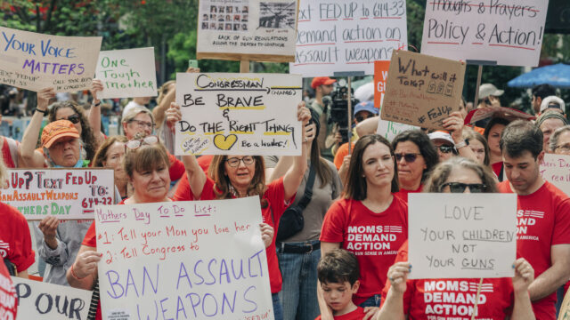 Moms Demand Action volunteers rally and hold up signs in Union Square, New York City