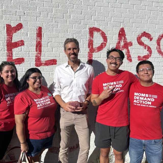 Moms Demand Action volunteers pose for a photo with Beto O'Rourke