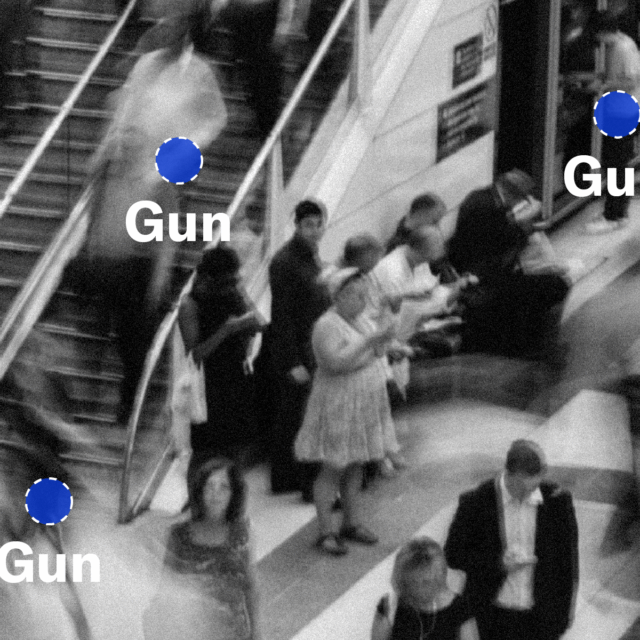 A black-and-white depiction of people moving through a public space with three blue dots overlaid on three people with the word 