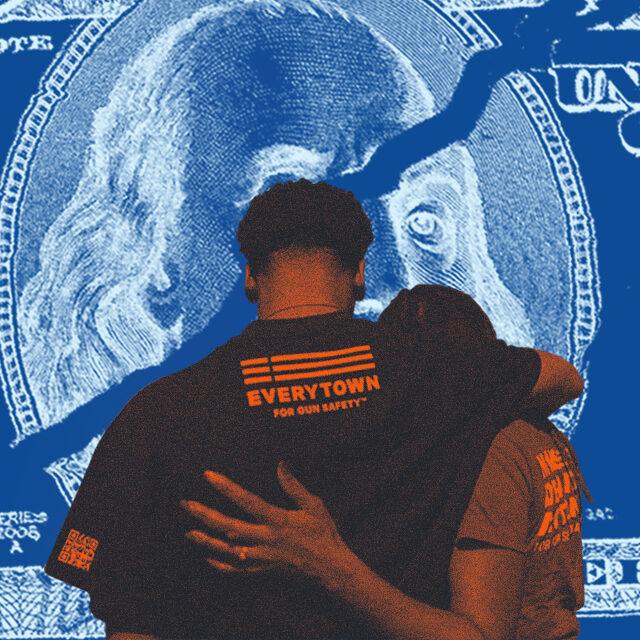Two people stand side-by side with one arm around the other; one has black t-shirt with the Everytown for Gun Safety three-line flag logo styled in orange text. They are superimposed in front of a blue-toned image of an enlarged, ripped dollar bill, representing the CVI federal funding cuts by the Trump administration in April 2025.